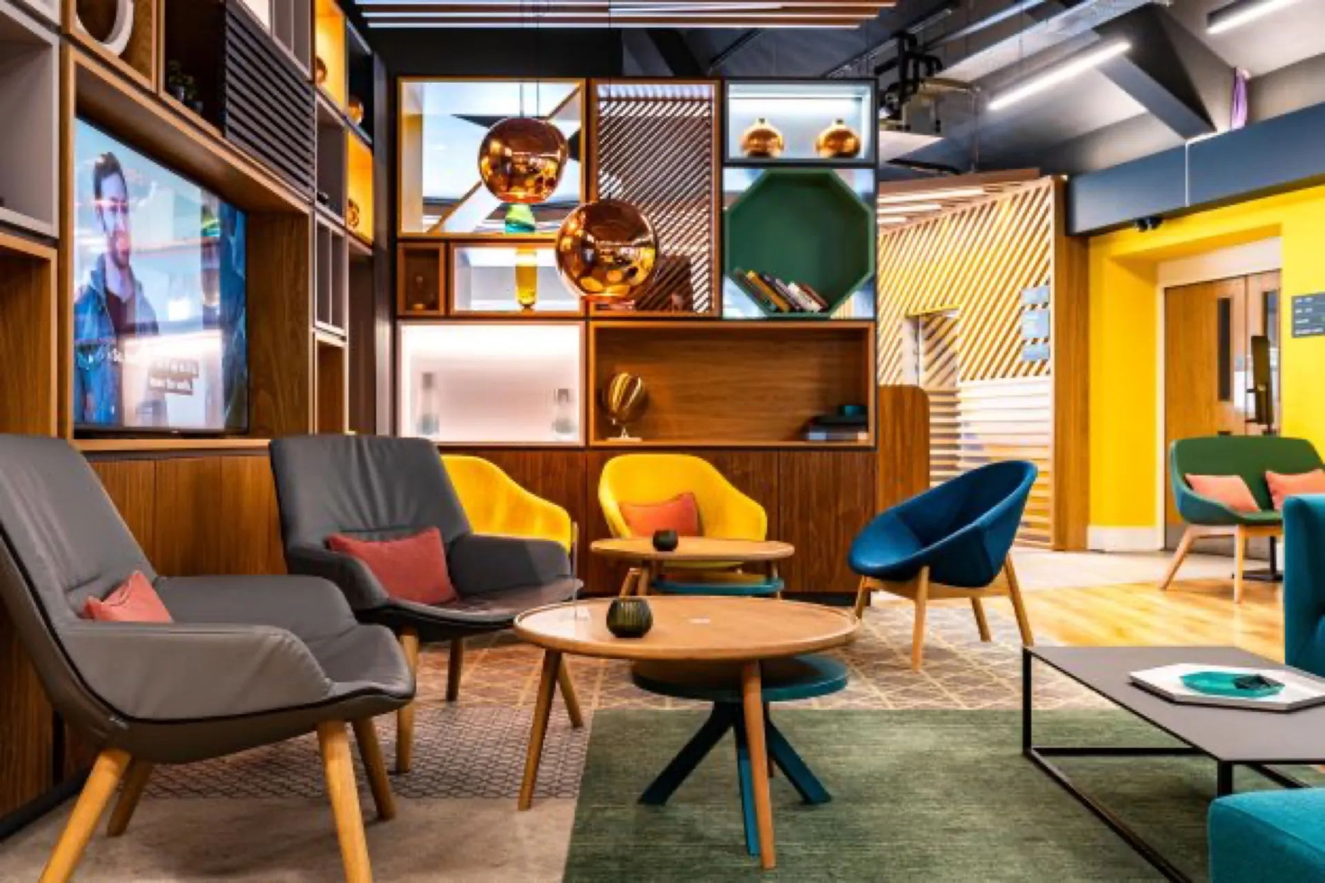 Lobby lounge at Holiday Inn Express Canterbury, mustard and teal armchairs