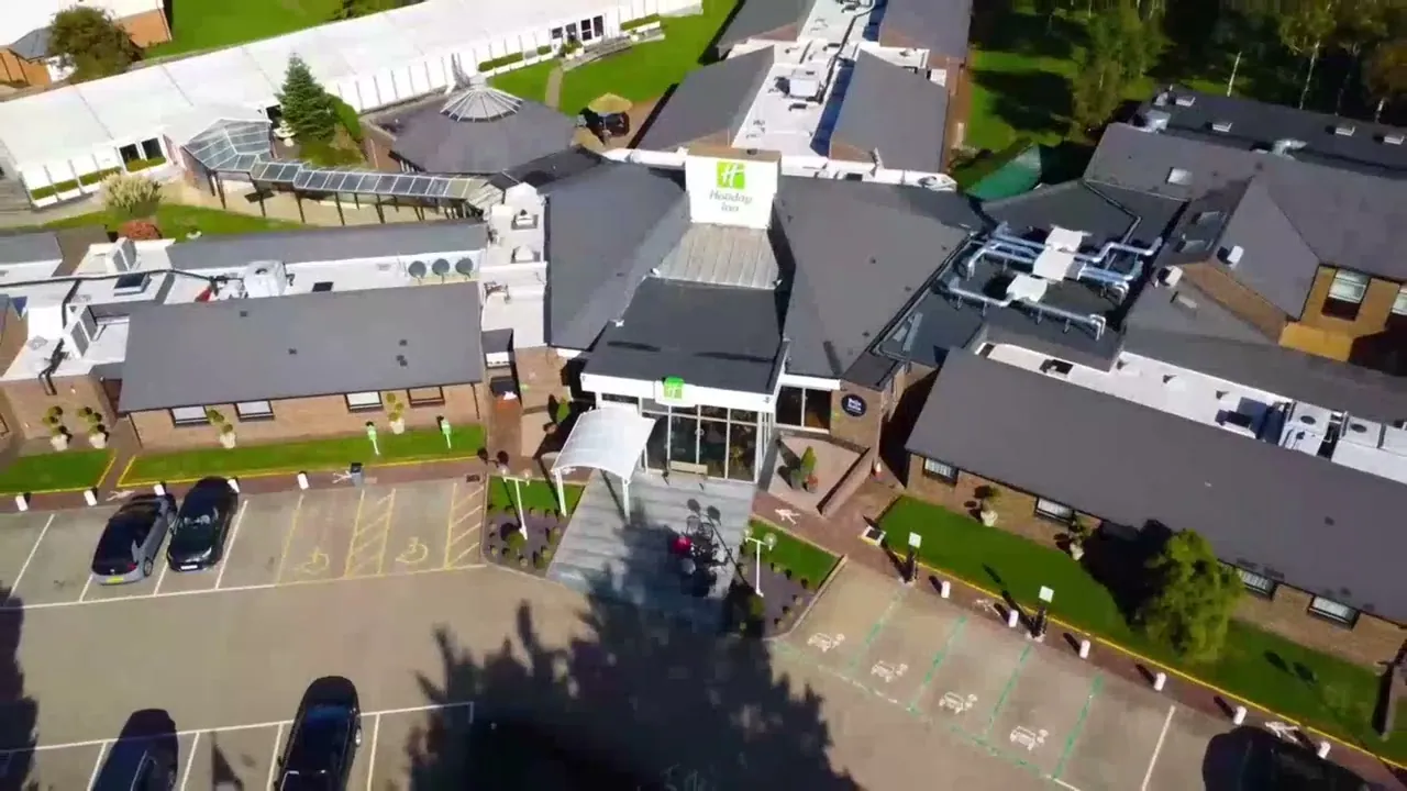 Holiday Inn Dover from the air: low white buildings in a landscaped garden