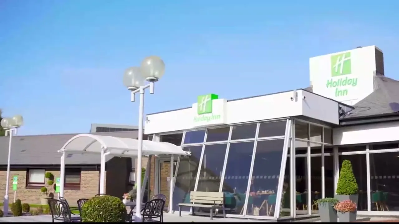 The glass entrance of Holiday Inn Dover